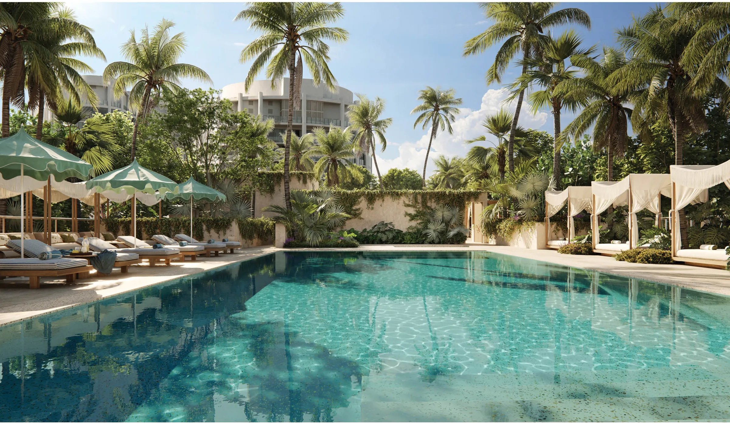 A resort pool framed by palms